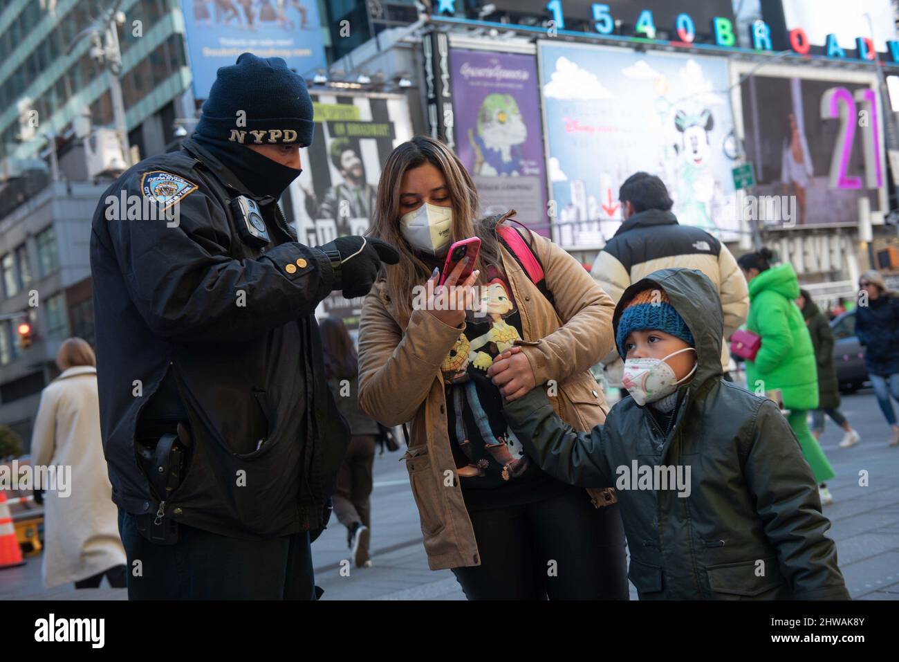 New York, USA. 05th Mar, 2022. (220305) -- NEW YORK, March 5, 2022 (Xinhua) -- A women talks with a police officer on Times Square in New York, the United States, March 4, 2022. New York City will suspend COVID-19 vaccine passport program and remove indoor mask mandate in public schools for K-12 students starting from next Monday, said New York City Mayor Eric Adams at a press briefing on Friday. The decision is based on a sharp drop of new COVID-19 cases and hospitalizations as well as 96 percent of vaccination rate among adults in the city. (Michael Appleton/Mayoral Photography Office/Handou Stock Photo