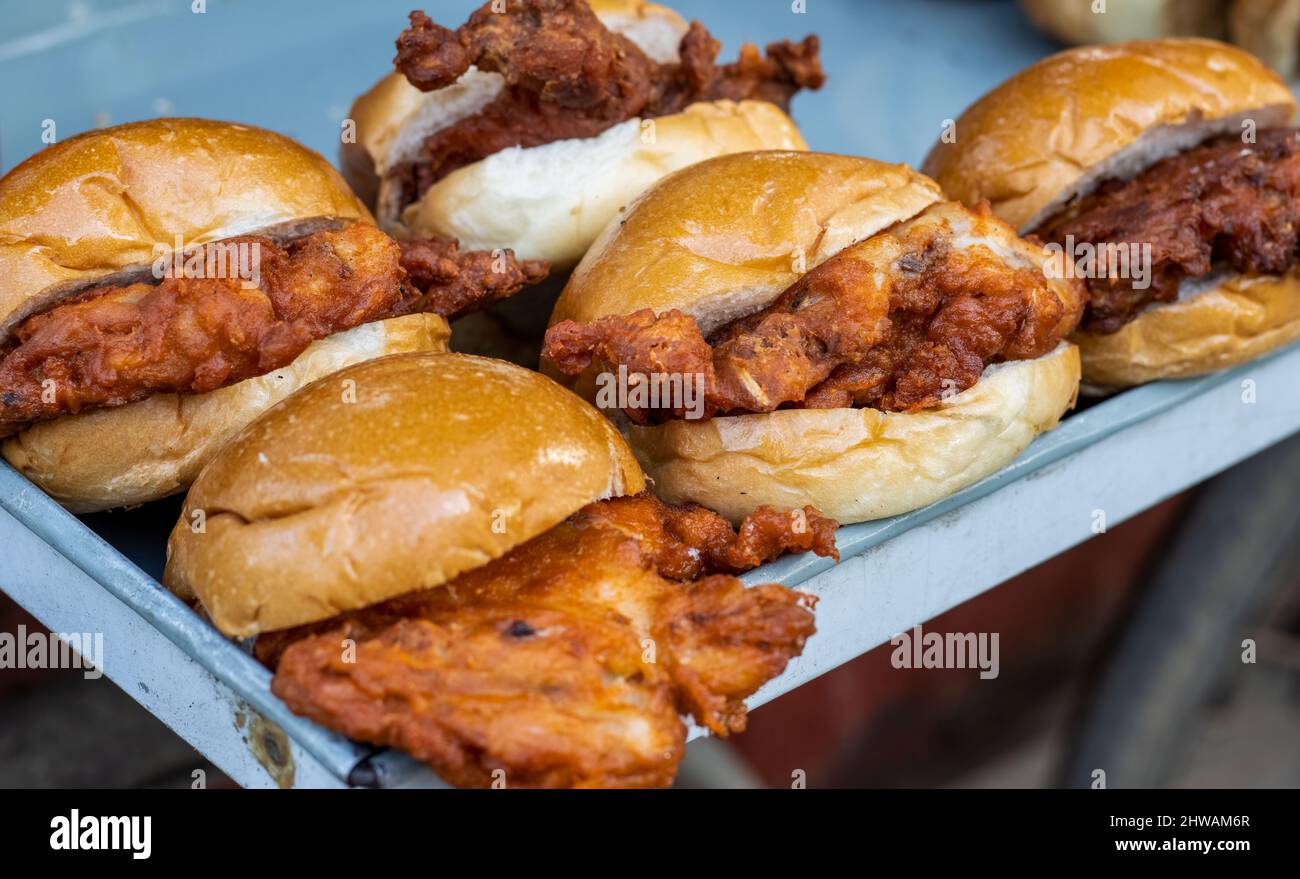Delicious fried chicken burgers on the street food market close up