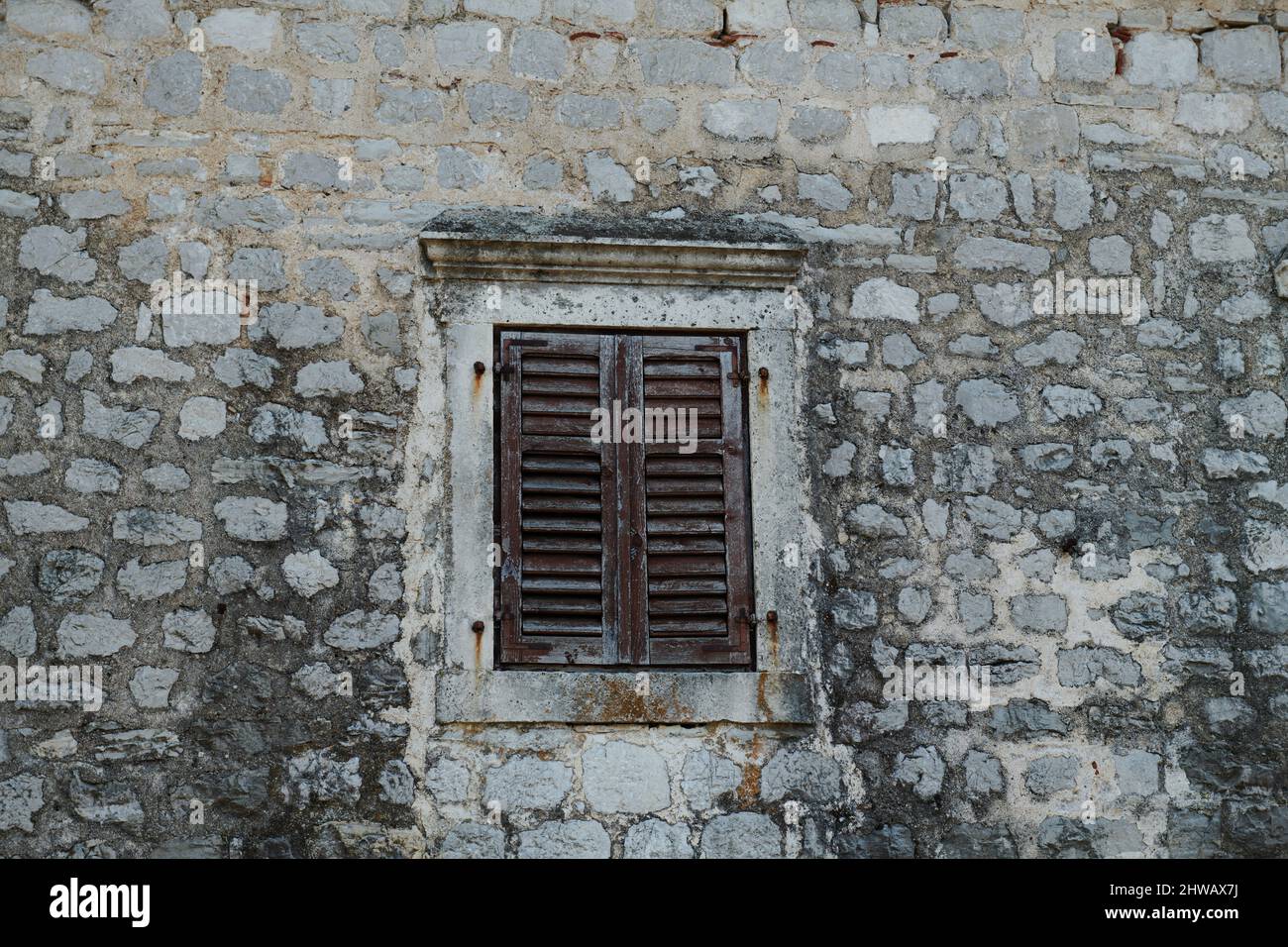 the stone wall is old and the window with shutters Stock Photo - Alamy