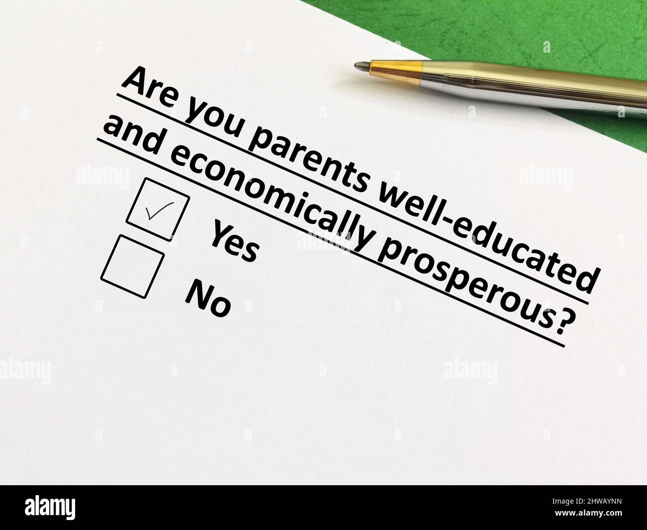 One person is answering question about social inequality. The person thinks his parents are well education and economically prosperous. Stock Photo