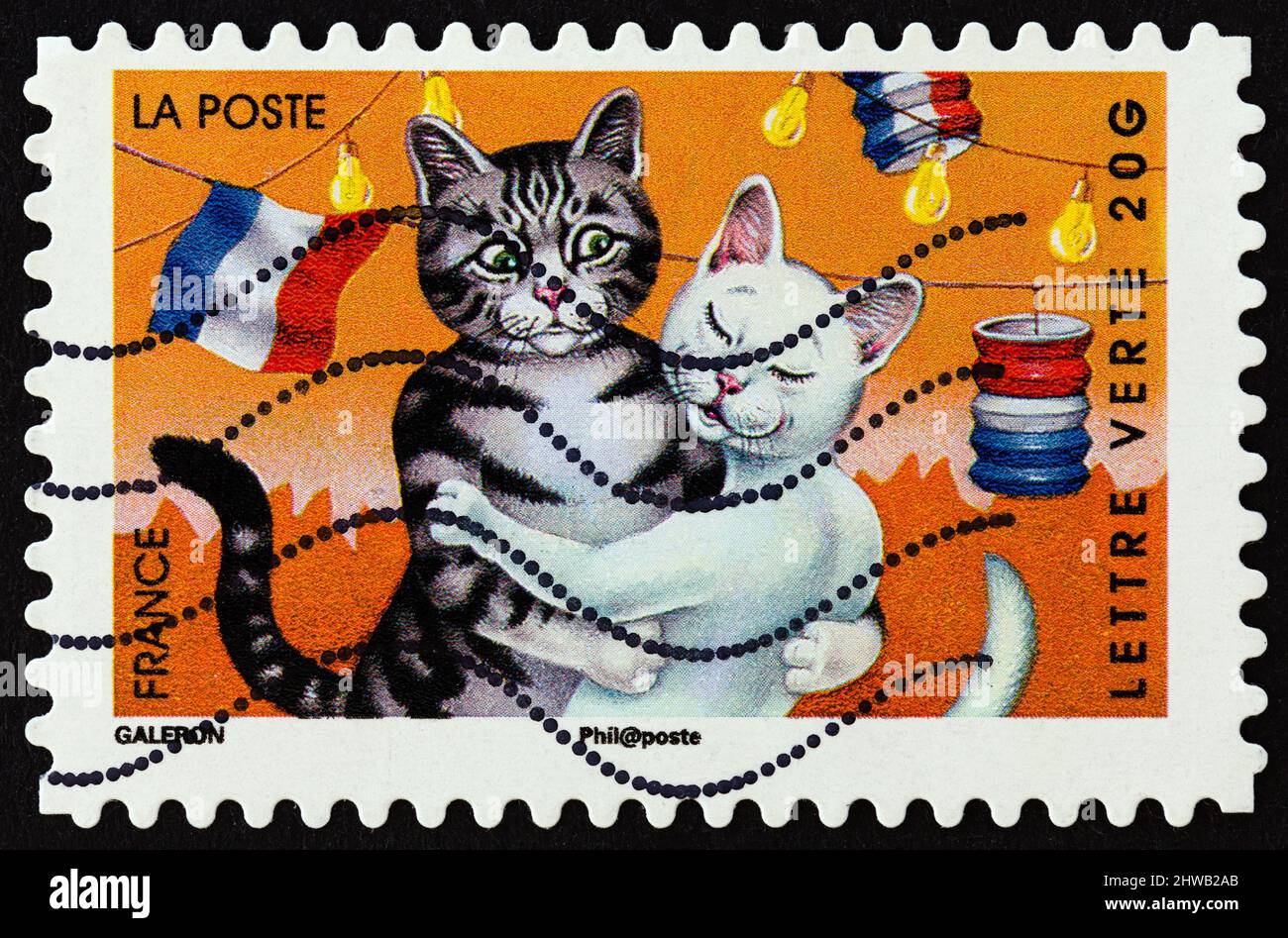 FRANCE - CIRCA 2014: A stamp printed in France from the 'Holiday' issue shows cats, circa 2014. Stock Photo