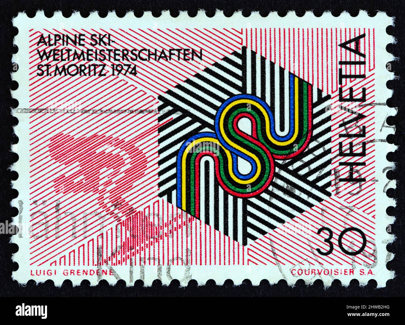SWITZERLAND - CIRCA 1973: A stamp printed in Switzerland issued for the World Alpine Skiing Championships, St. Moritz 1974, shows skiing emblem. Stock Photo