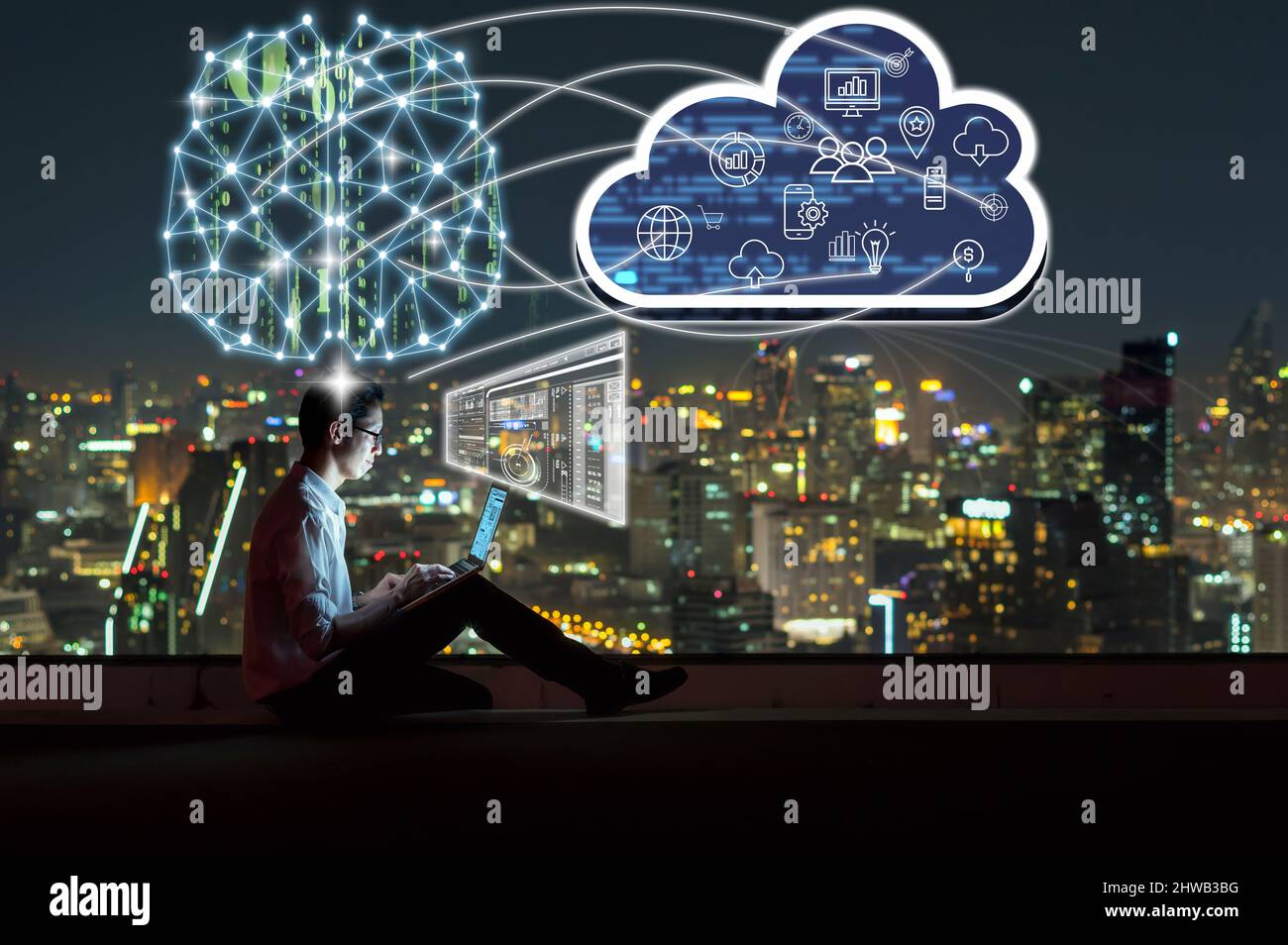 Asian businessman sitting and using the laptop and working with brain and virtual screen connecting with cloud technology over the cityscape backgroun Stock Photo