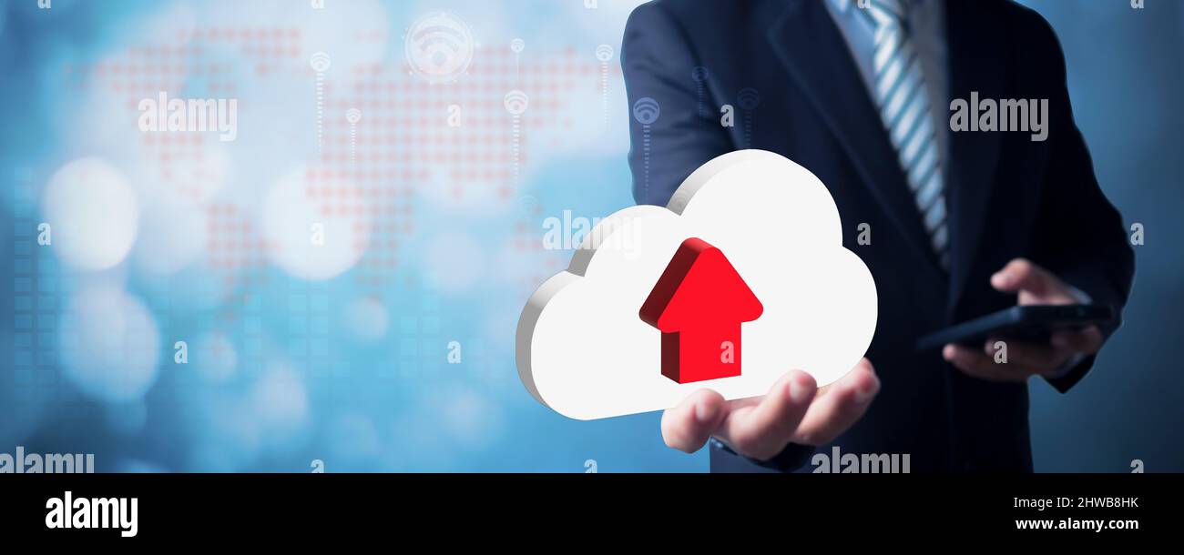 Businessman holding cloud icon and uploading data by phone, Cloud computing technology and online data storage for business network concept Stock Photo