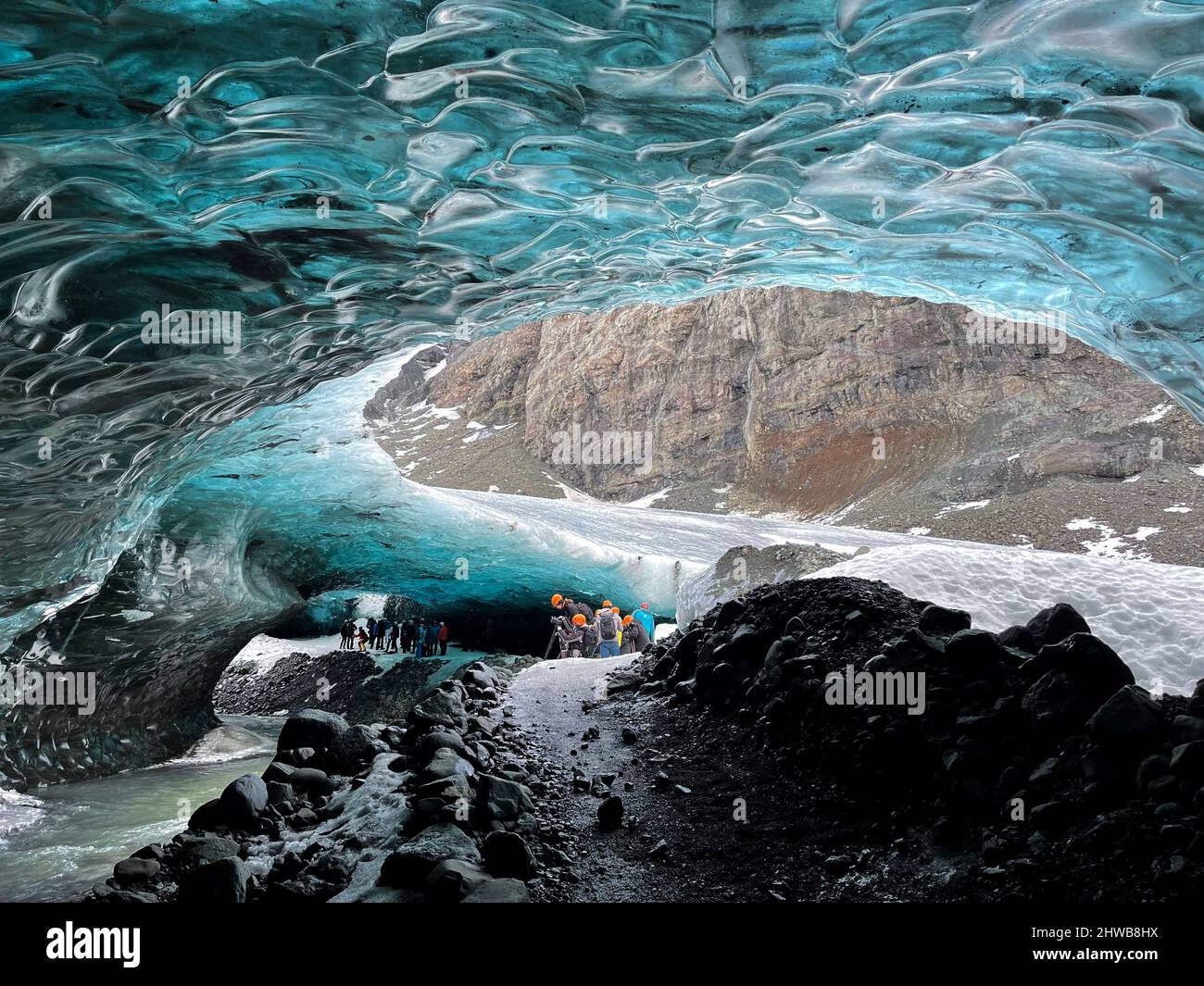 Tourists inside a glacier in Skaftafell National Park, in Iceland. The glacier of Vatnajökull is a huge glacier at the southern Iceland, Europe Stock Photo