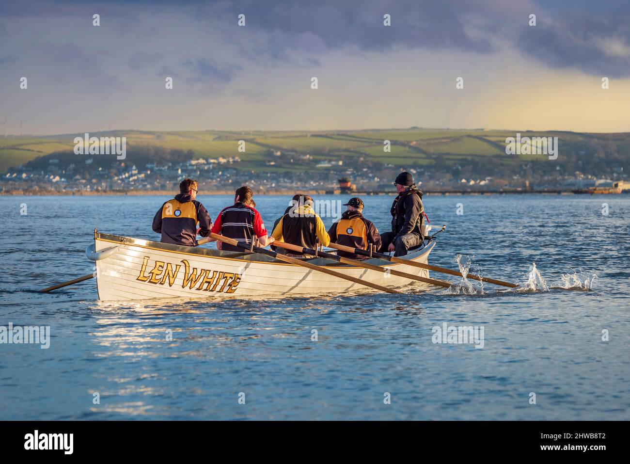 Appledore, North Devon, UK. Saturday 5th March 2022. After a chilly night on the coast of North Devon, the Pilot Gig boat 'Len White' leaves the quay at the coastal village of Appledore in North Devon. Credit: Terry Mathews/Alamy Live News Stock Photo