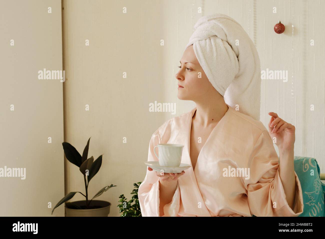 Woman in pajamas drinking coffee hi-res stock photography and