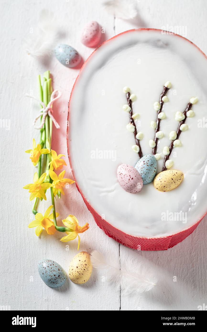 Sweet Easter cake made with yellow daffodils Easter chocolate cake with eggs. Stock Photo
