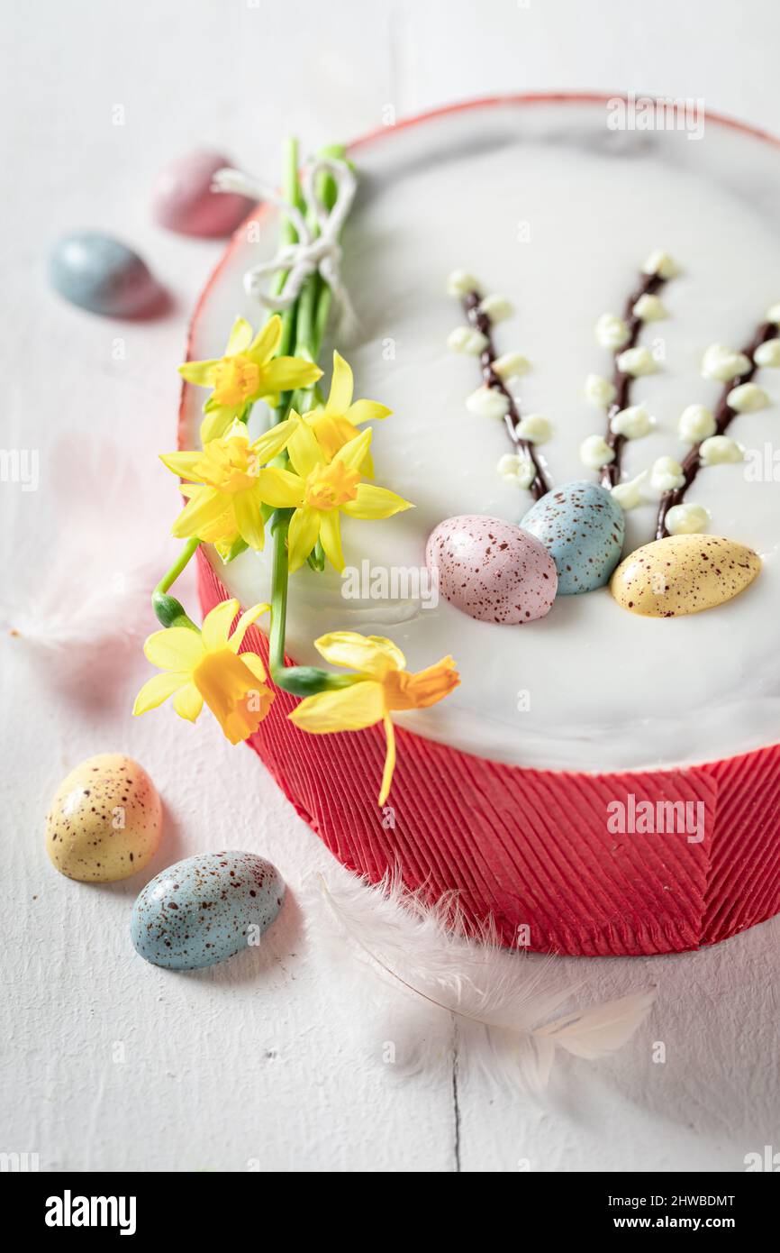 Delicious Easter cake made with yellow daffodils Easter chocolate cake with eggs. Stock Photo