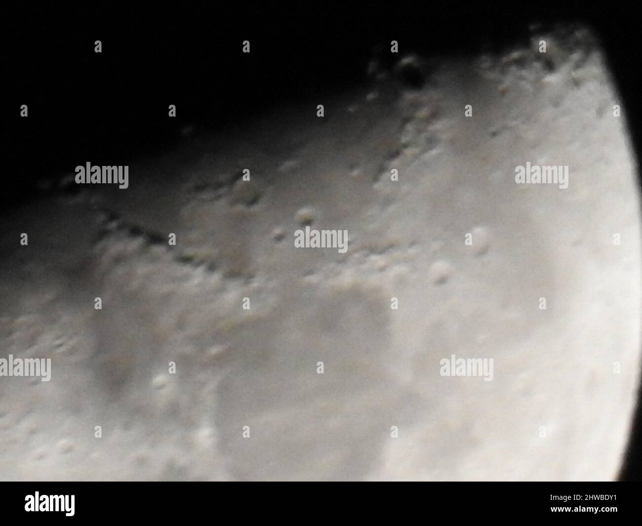 moon view at night from earth looking awesome,the dark spot of the moon also showing clearly in the view Stock Photo