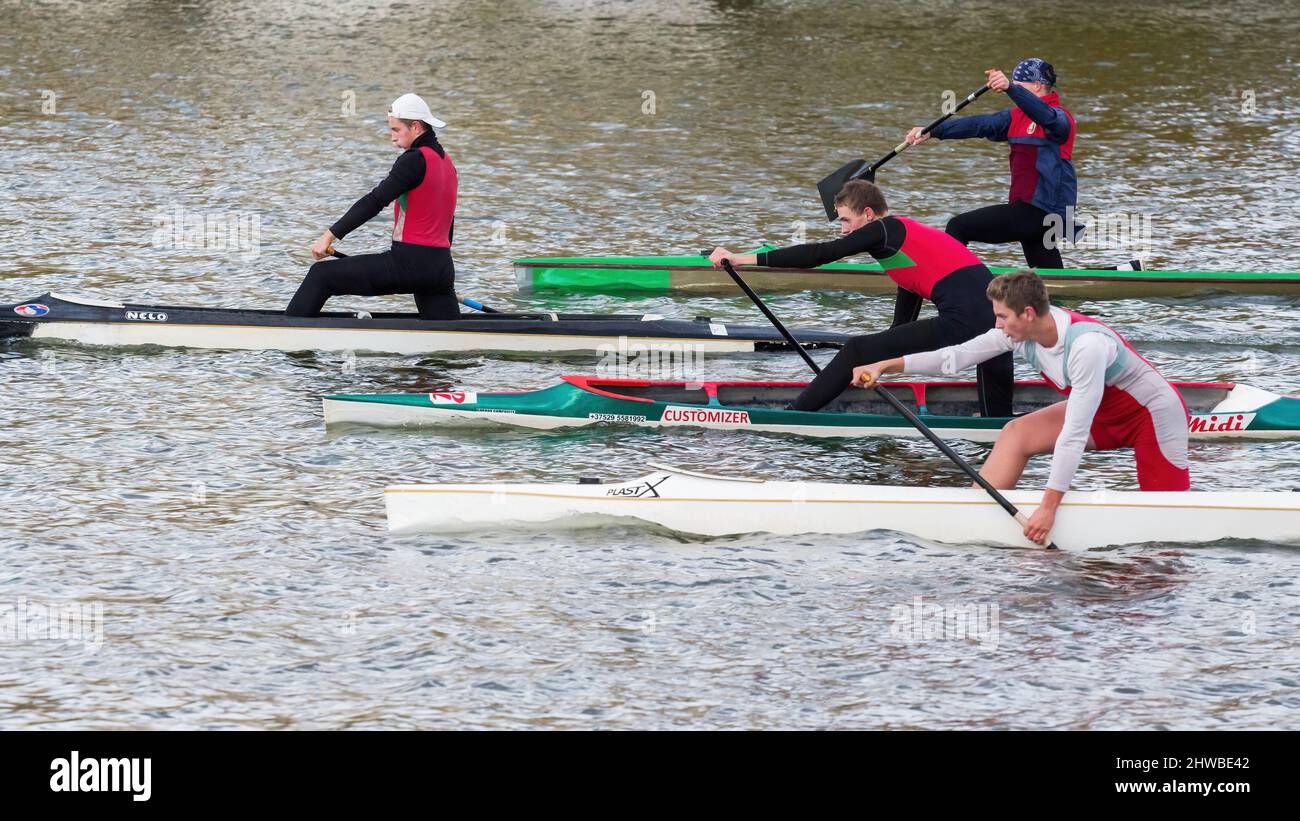 A group of young rowing canoeists trains in open water Stock Photo