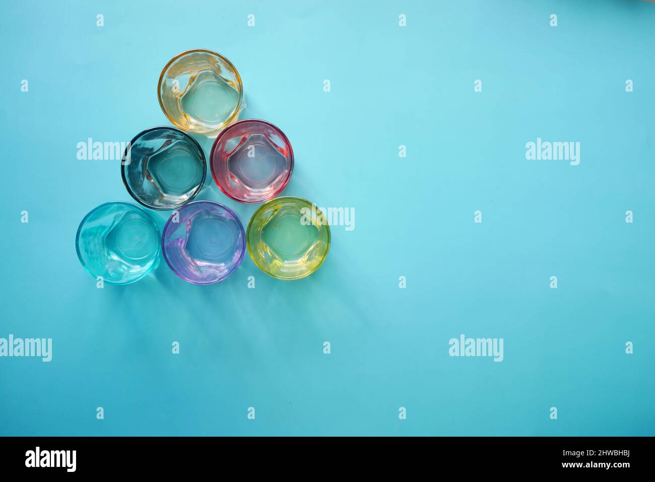top view of empty drinking glasses on blue background  Stock Photo