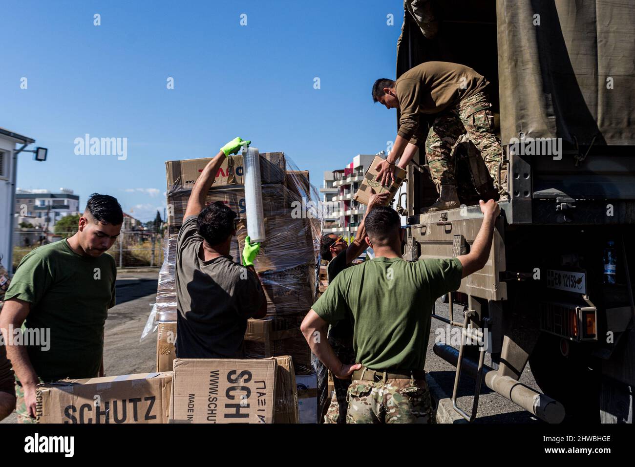 Soldiers are seen building pallets with goods ready for dispatching to  Ukraine., Limassol, Cyprus, on Mar. 5, 2022. The Commissioner for the  Citizen, Mr Panayiotis Sentonas, visits Lemesos New Port and makes