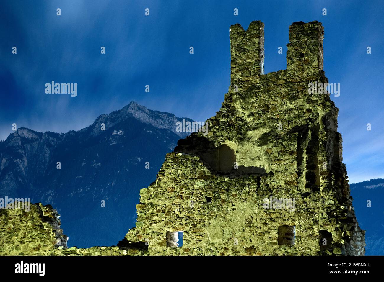 The spooky ruins of Selva Castle and mount Cima Vezzena in winter. Levico Terme, Trento province, Trentino Alto-Adige, Italy, Europe. Stock Photo