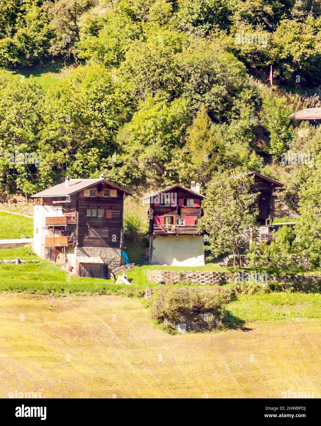 Wooden houses in the Swiss Alps in the Saint Luc valley on a cloudy day