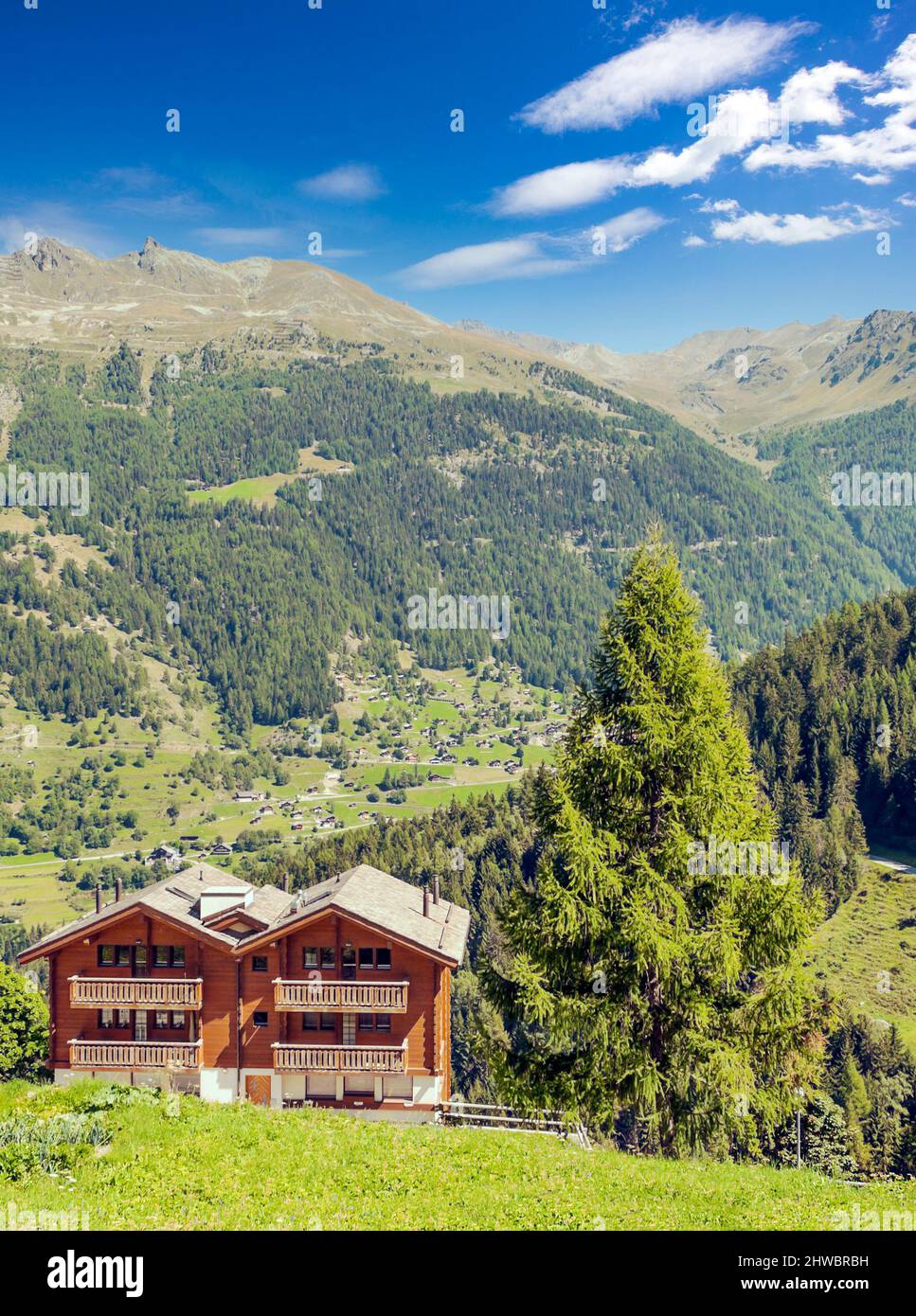 Wooden houses in the Swiss Alps in the Saint Luc valley on a cloudy day