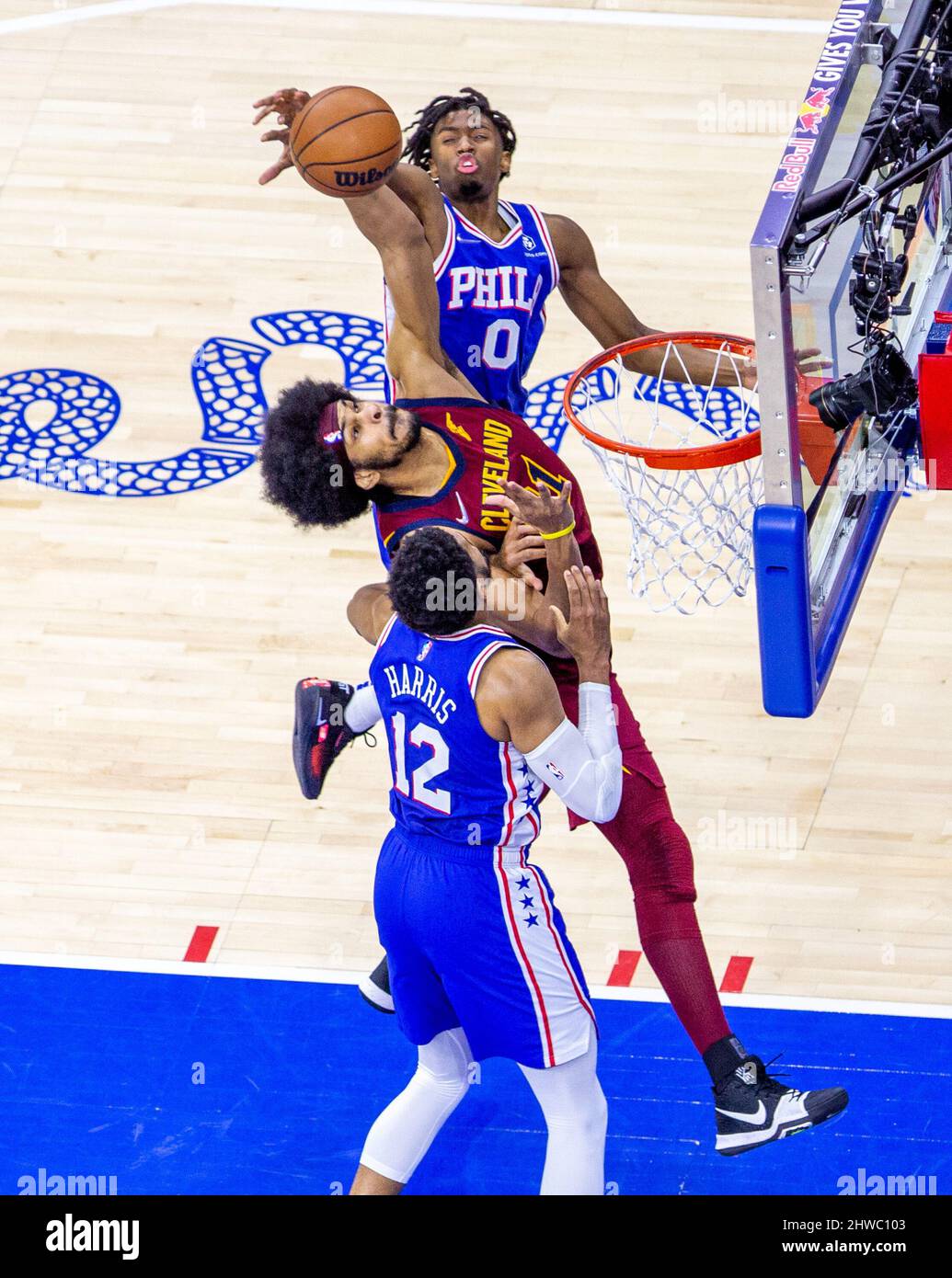 Tyrese Maxey (76ers 0)
and Tobias Harris (76ers 12)
trying to block  Jarrett Allen (Cavaliers 31) shot during the National Basketball  Association game between the Philadelphia 76ers and Cleveland Cavaliers at  Wells Fargo Center