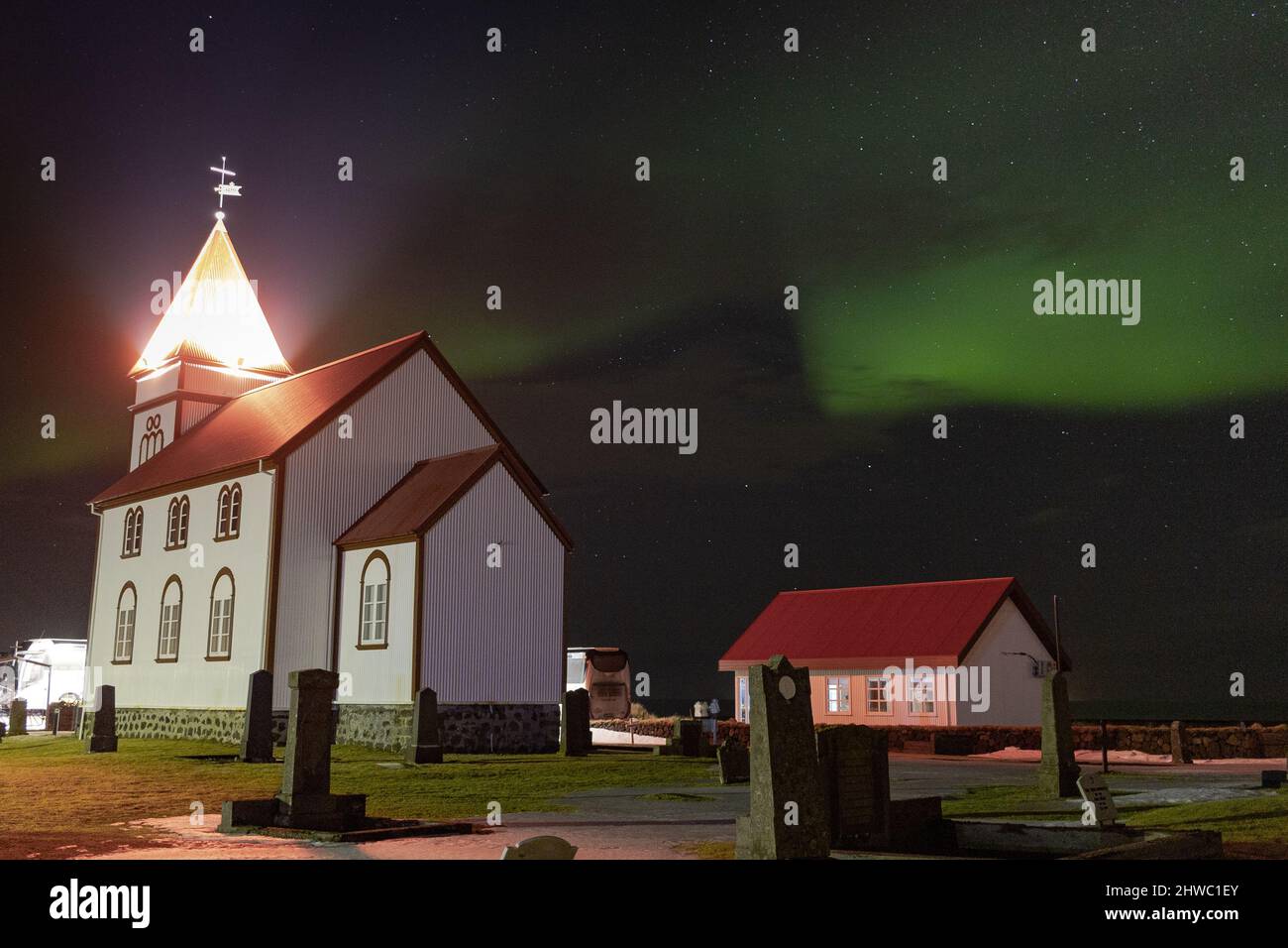 Northern lights over Garður lighthouse & churches Stock Photo Alamy