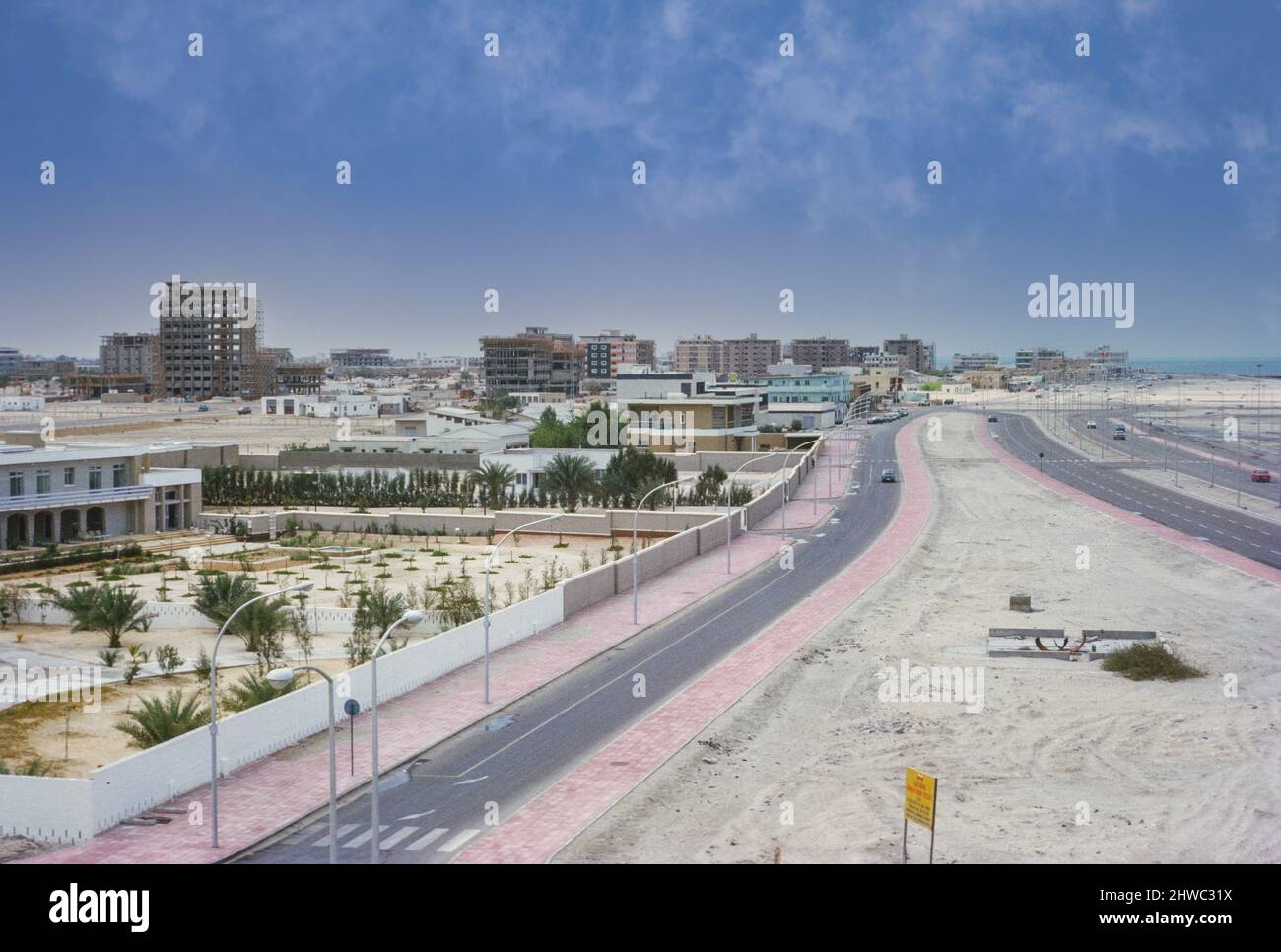 Abu Dhabi, UAE.  Corniche Street Scene.  Abu Dhabi begins its modern development. Persian (Arabian) Gulf in distance on right.  Photographed March 1972. Stock Photo