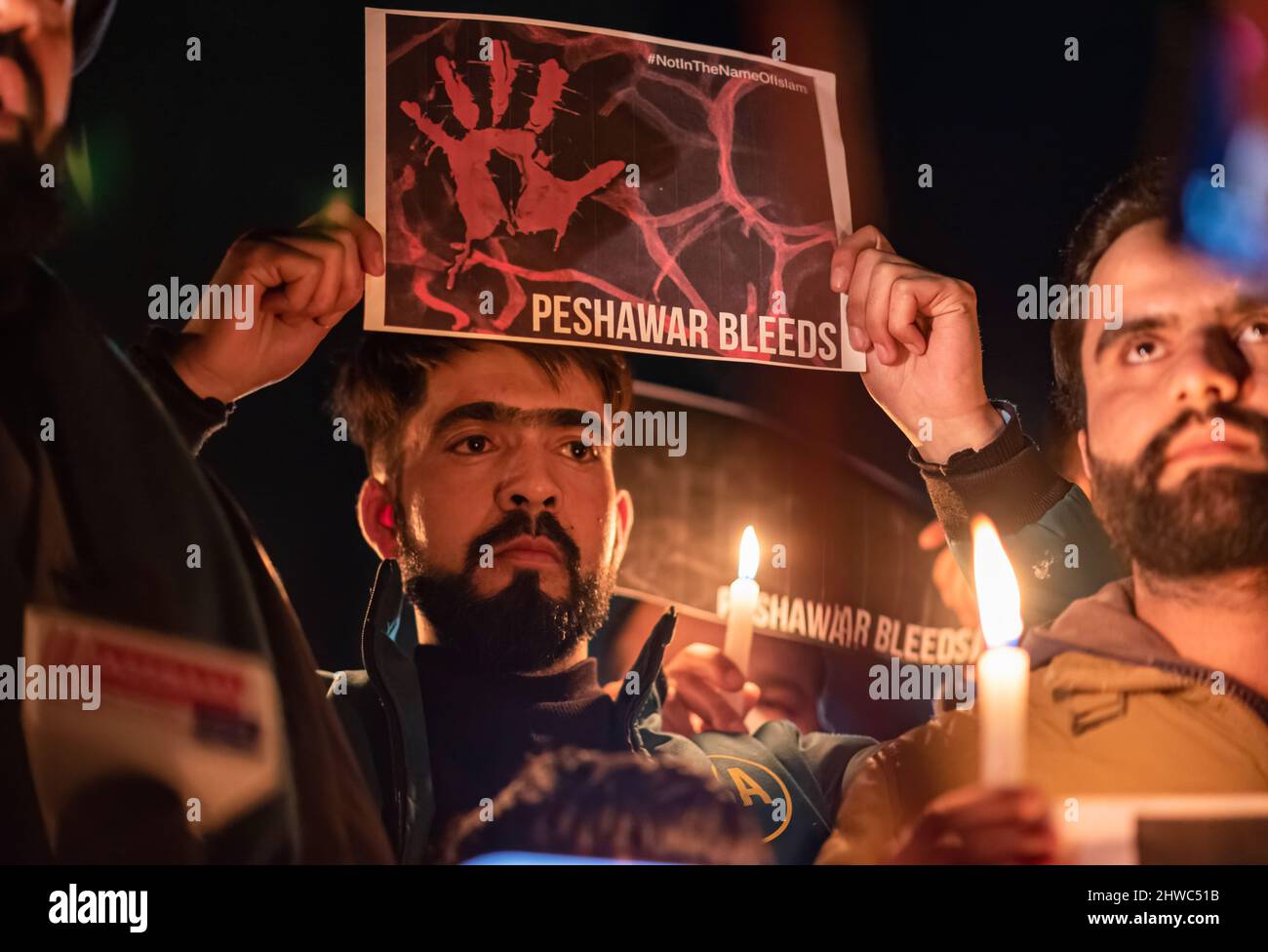 Kashmir, India. 04th Mar, 2022. A Shia Muslim man holds a placard ...