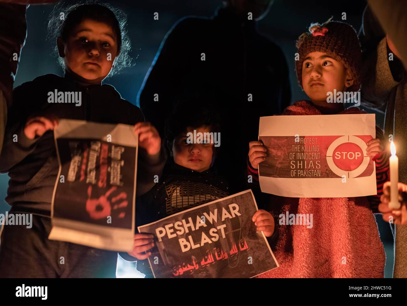 Kashmir, India. 04th Mar, 2022. Shia Muslim kids hold placards during a ...