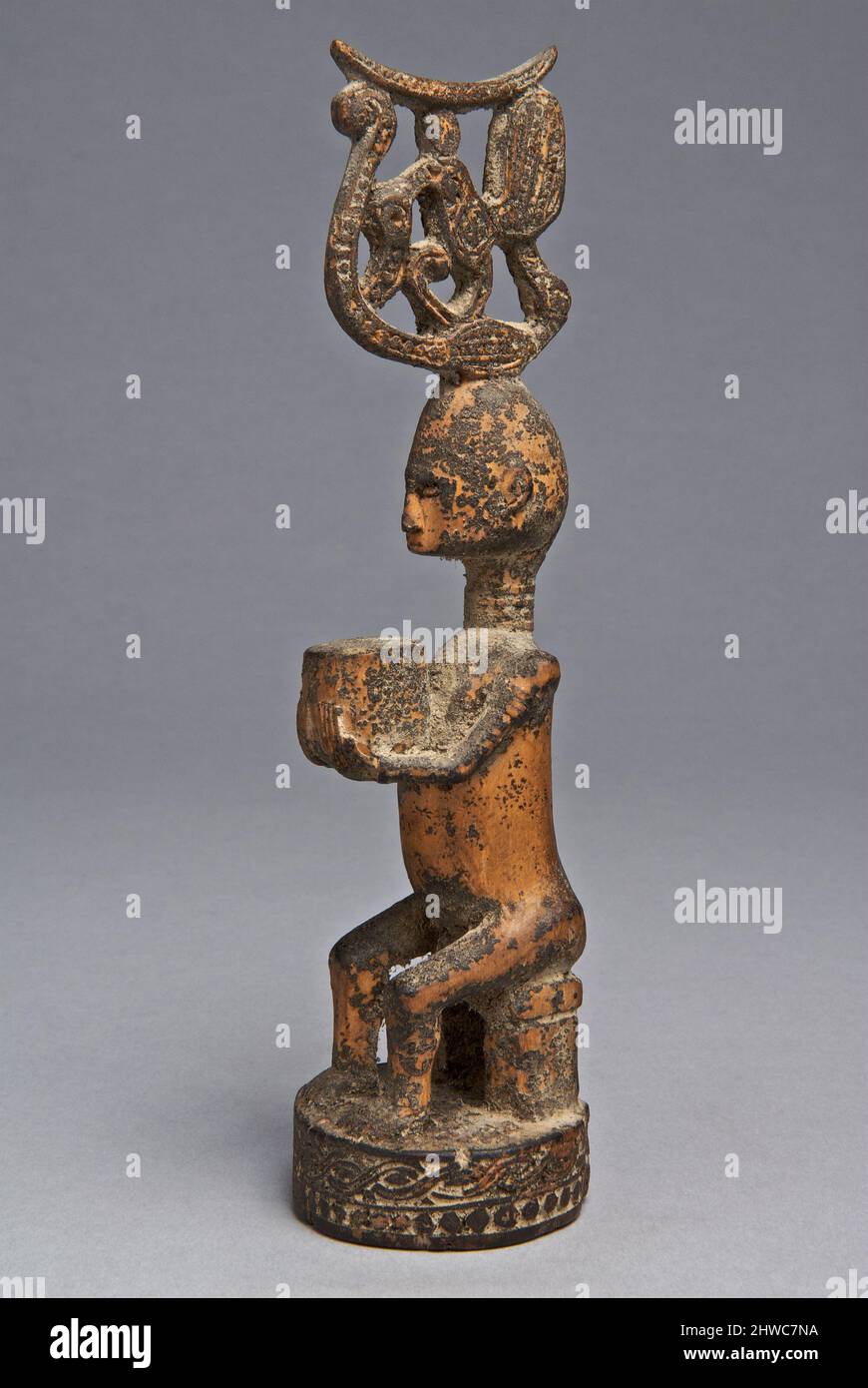 Ancient Ritual Using Bird Heads Seated Figure with a Bird Headdress Stock Photo - Alamy