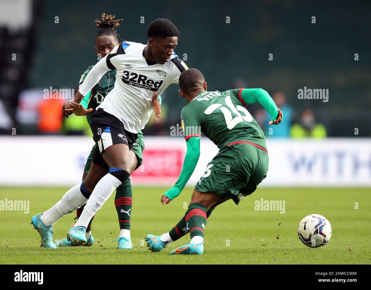 Derby County's Malcolm Ebiowei (left) and Barnsley's Remy Vita battle ...
