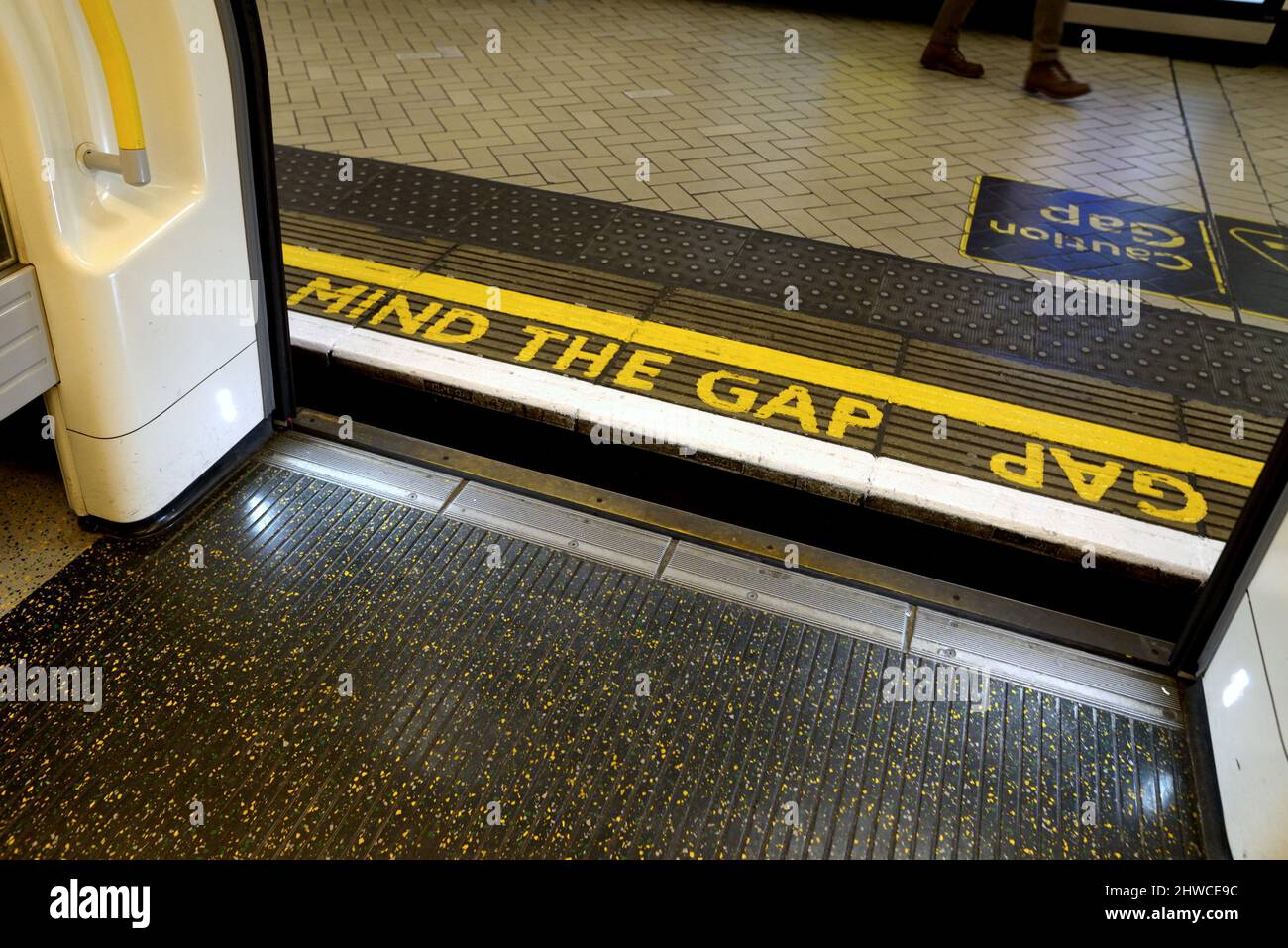 London, England, UK. Open tube train doors, showing Mind The Gap Stock Photo