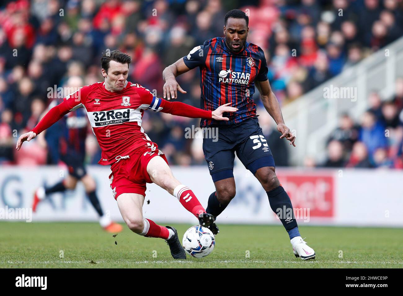 Middlesbrough's Jonny Howson and Luton Town's Cameron Jerome in action during the Sky Bet Championship match at the Riverside Stadium, Middlesbrough. Picture date: Saturday March 5, 2022. Stock Photo