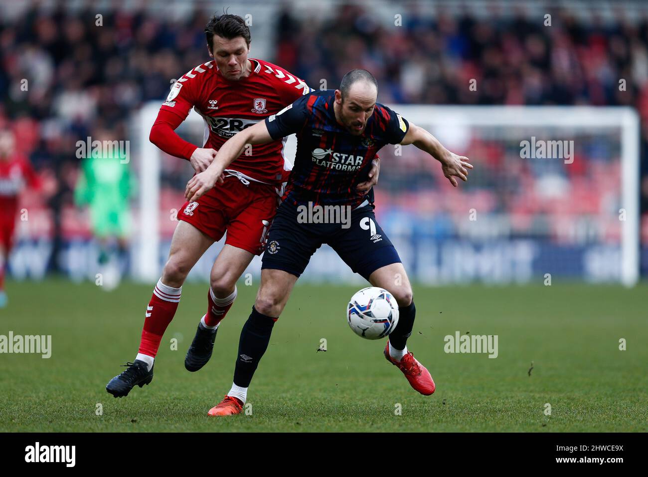Luton Town's Danny Hylton and Middlesbrough's Jonny Howson in action during the Sky Bet Championship match at the Riverside Stadium, Middlesbrough. Picture date: Saturday March 5, 2022. Stock Photo