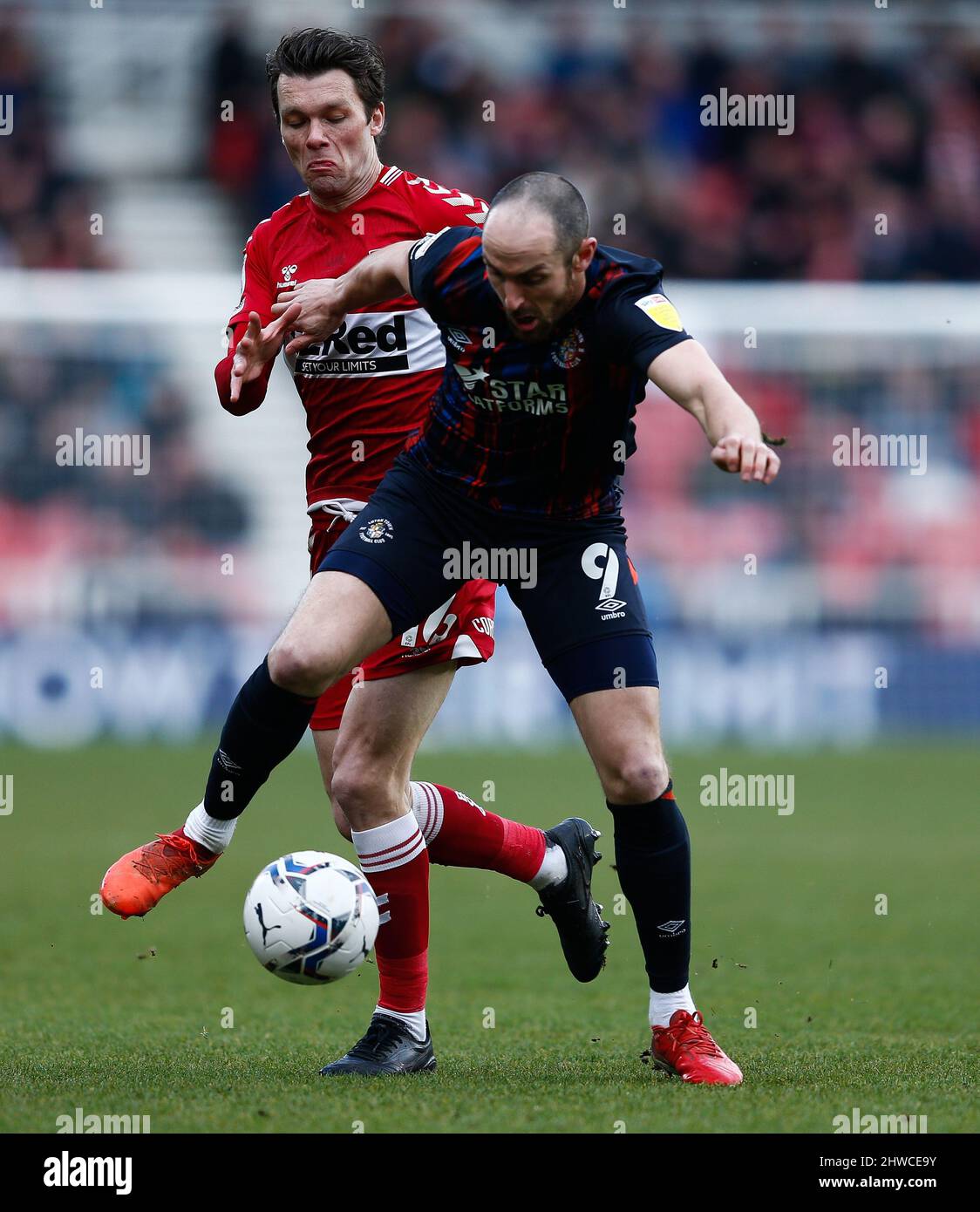 Luton Town's Danny Hylton and Middlesbrough's Jonny Howson in action during the Sky Bet Championship match at the Riverside Stadium, Middlesbrough. Picture date: Saturday March 5, 2022. Stock Photo