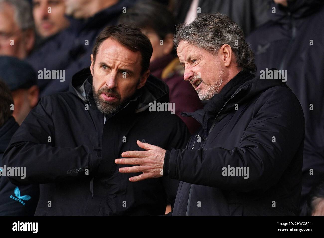 England manager Gareth Southgate (left) with Wolverhampton Wanderers technical director Scott Sellars in the stands before the Premier League match at Molineux Stadium, Wolverhampton. Picture date: Saturday March 5, 2022. Stock Photo