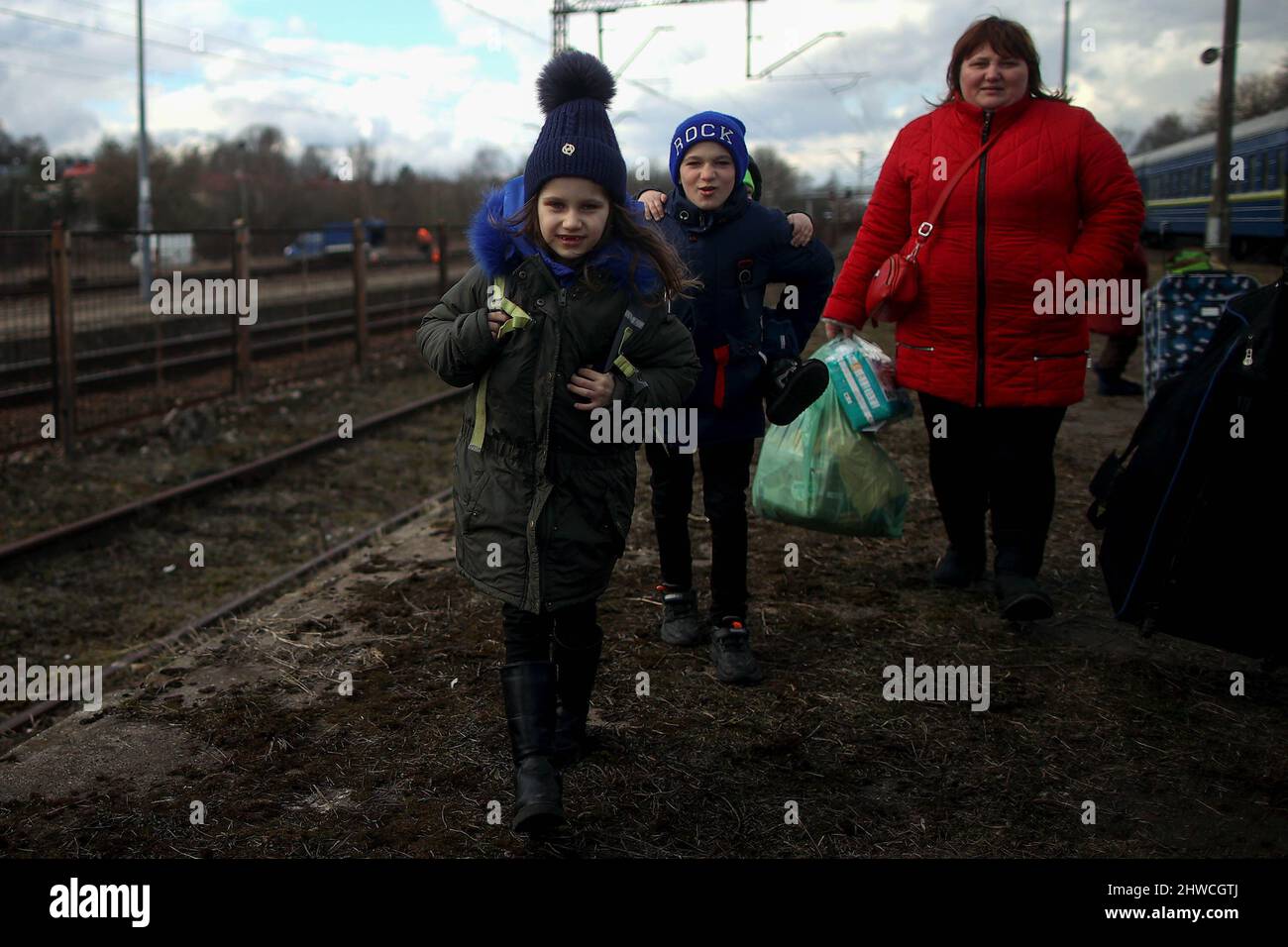 Ukrainian refugees seen at Olkusz train station. Over 700,000 Ukrainian people seek refuge in Poland as result of Russiaís aggression on their country. Many of them come to Polish cities by train, where humanitarian help is organized for those in need. Stock Photo