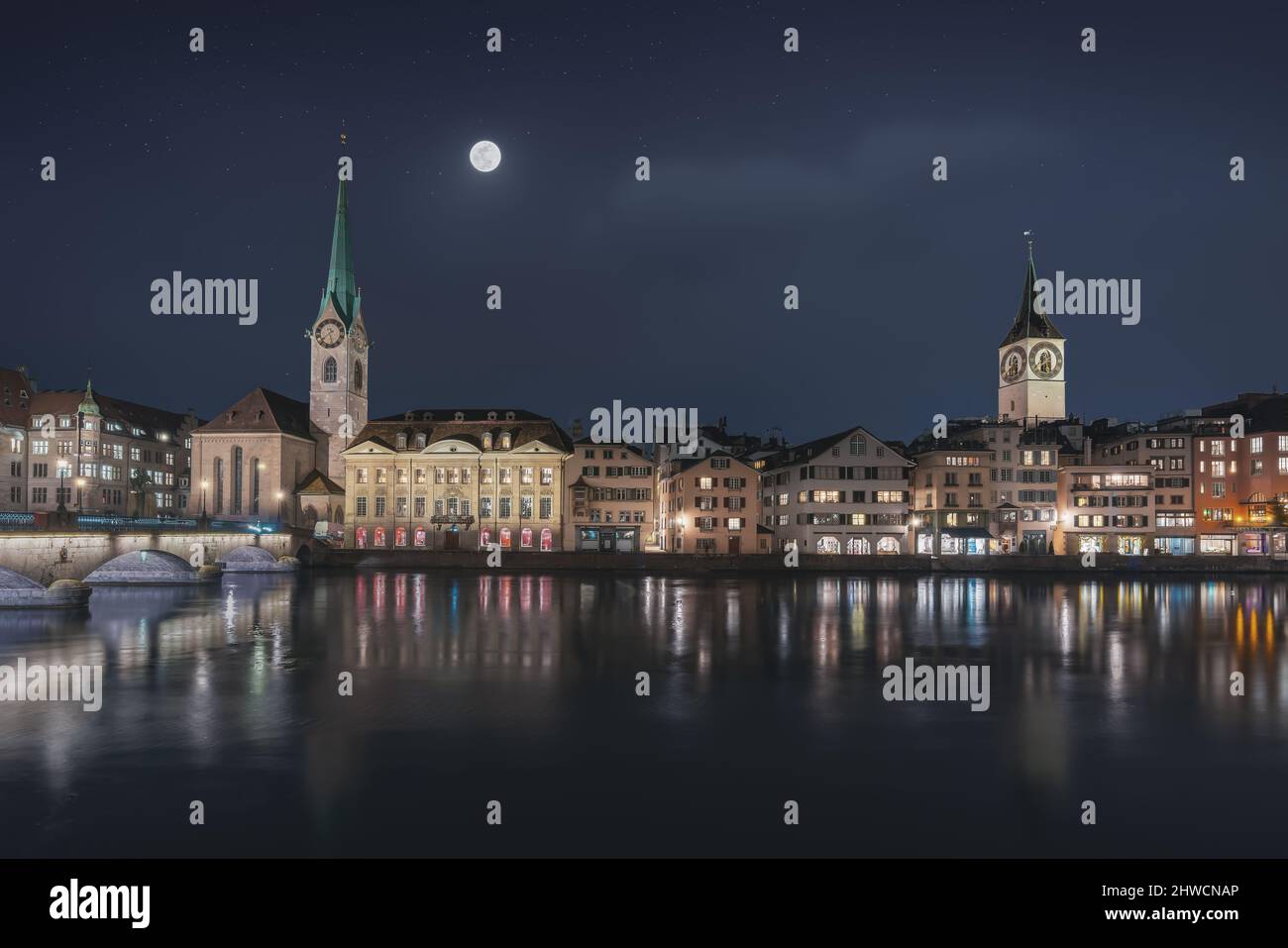 Zurich Skyline at night with Fraumunster Church and St Peters Church - Zurich, Switzerland Stock Photo