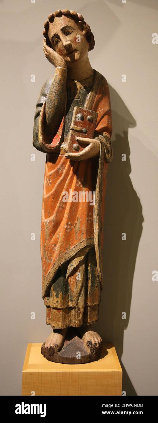 Calvary. Detail of St. John. Second half of the 13th century. Polychrome carving. Church of San Mamed from Tebongo, Asturies. Mares Museum. Barcelona, Stock Photo