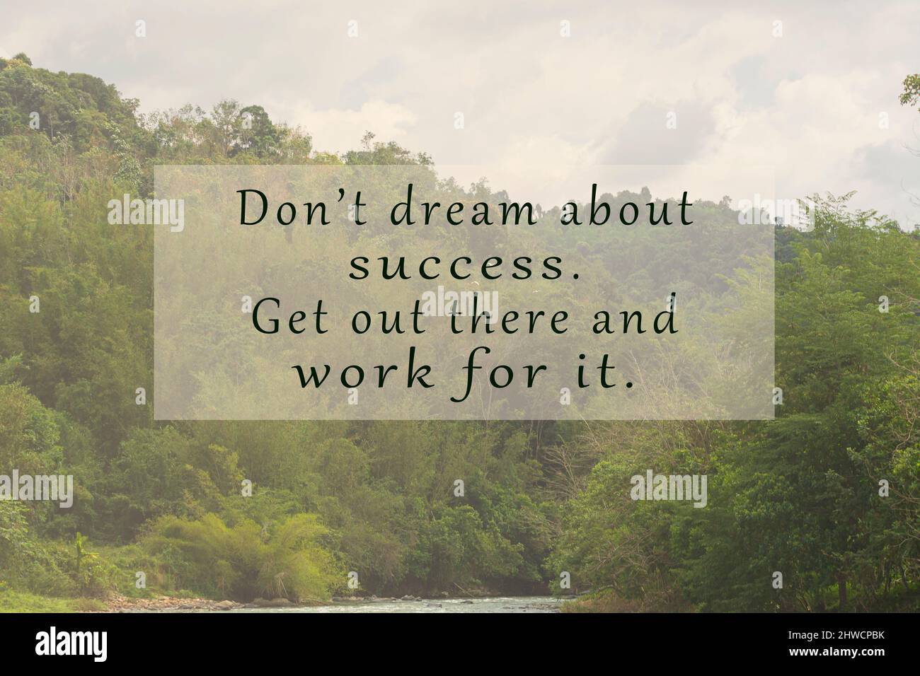 Motivational and inspirational quote on blurred background of trees and skies. Stock Photo