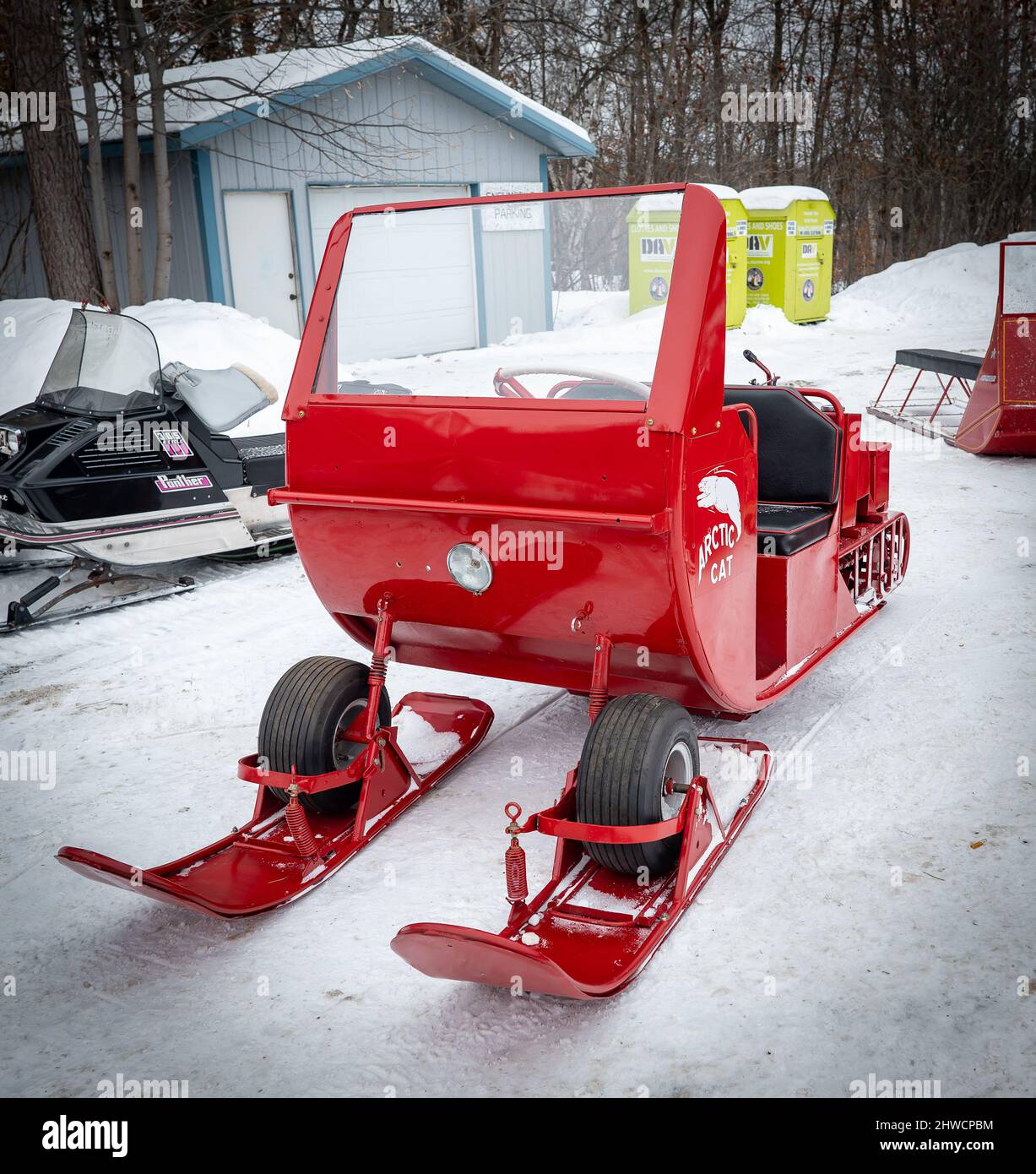 NISSWA, MN - 5 JAN 2022: Restored antique red Arctic Cat snowmobile, closeup on winter snow in Minnesota. 1960s vintage Stock Photo