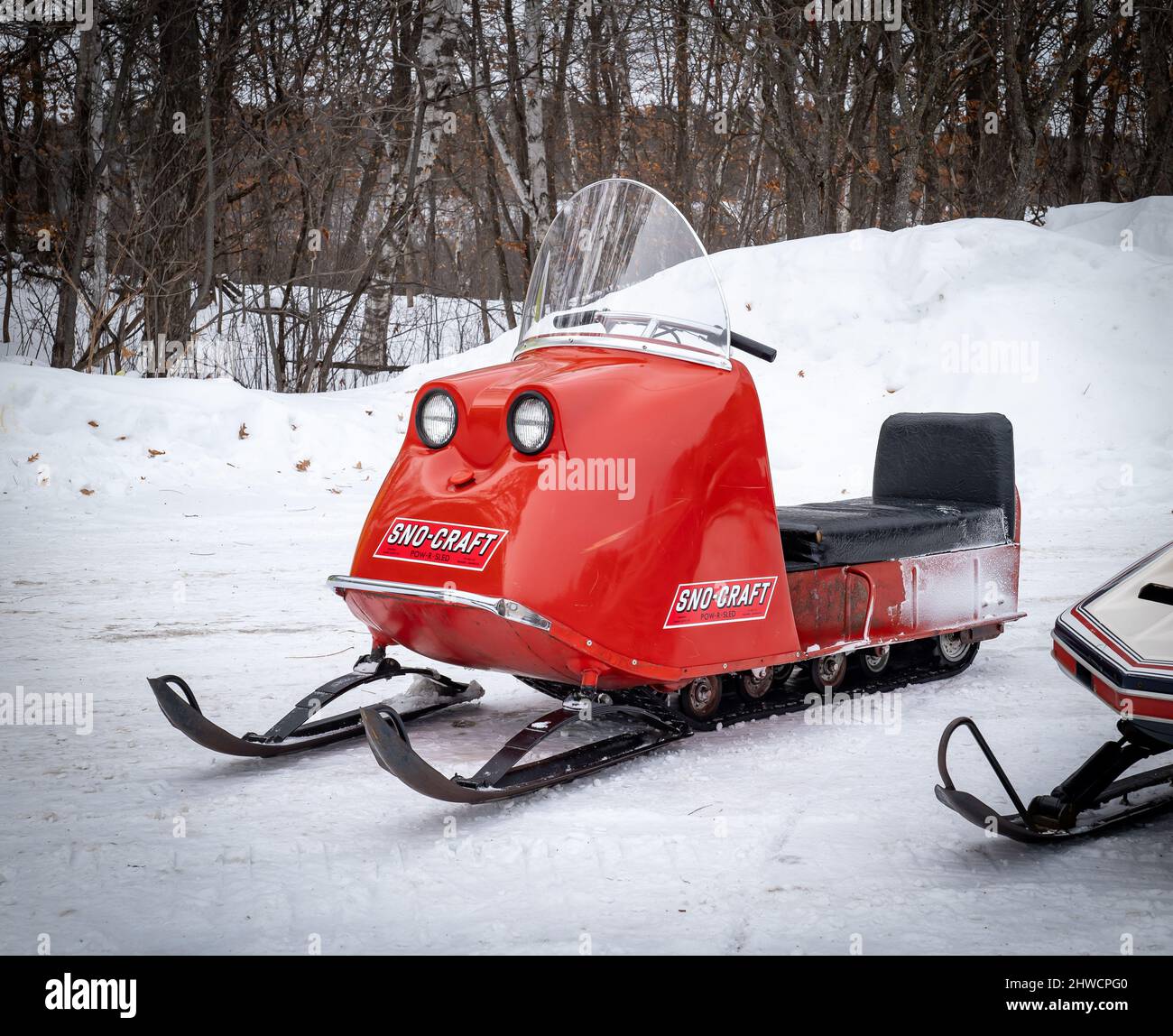 NISSWA, MN - 5 JAN 2022: Red antique Sno-Craft Pow-R-Sled NISSWA, MN - 5 JAN 2022: Red antique Sno-Craft Pow-R-Sled
