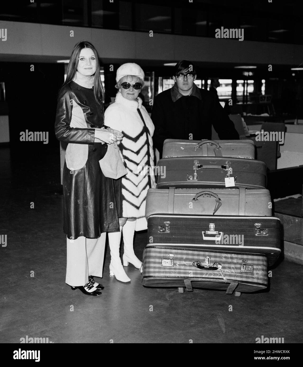 Singer Sandie Shaw seen here with her agent Eve Taylor before their departure to Montreux from Heathrow Airport. 24th February 1970 Stock Photo