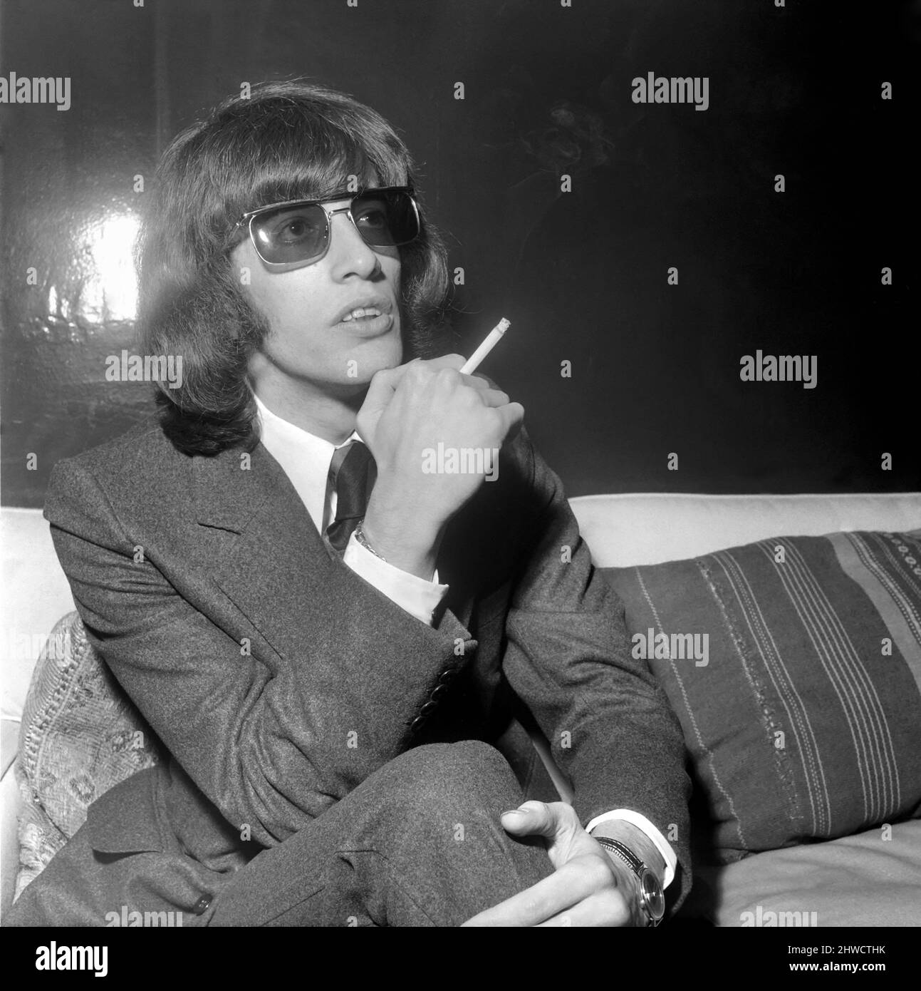 Robin Gibb of the Bee Gees pop group, smoking a cigarette.  April 1969. Stock Photo