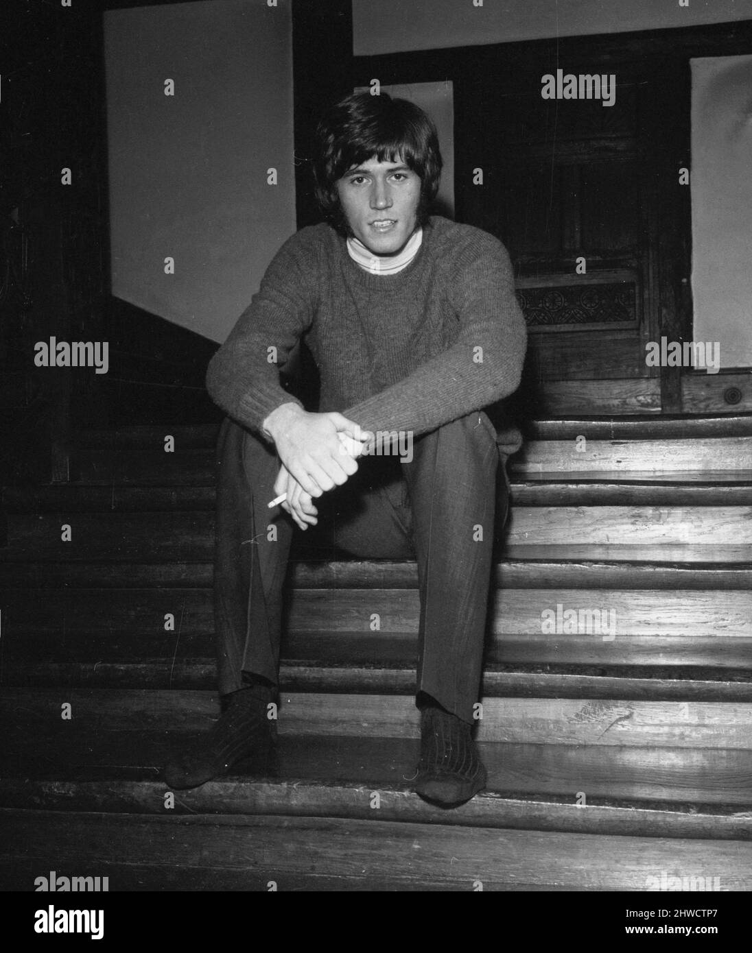 Barry Gibb of the Bee Gees pop group pictured at the home  of the group's manager Robert Stigwood in Stanmore, London February 1969 Stock Photo