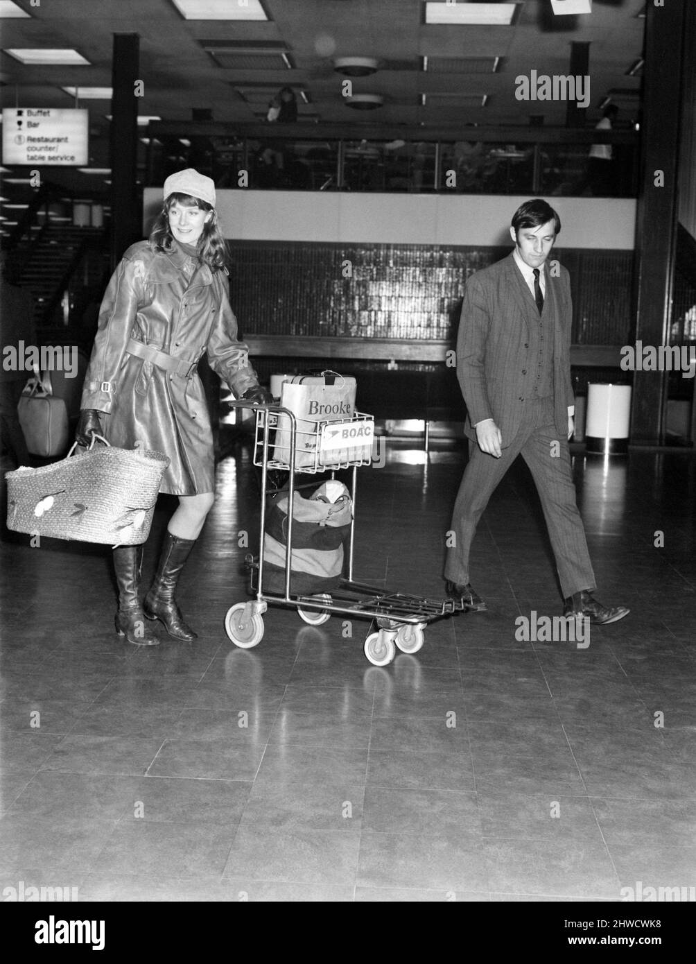 Entertainment. Film. Actress Vanessa Redgrave left Heathrow Airport  to fly to Madrid to be with her son's father Franco Nero. She was carrying her baby Carlo in what looked like a large raffia shopping basket. Vanessa Redgrave wearing all-leather clothes, with her baby Carlo in the large basket at Heathrow. November 1969 Z11252-002 Stock Photo