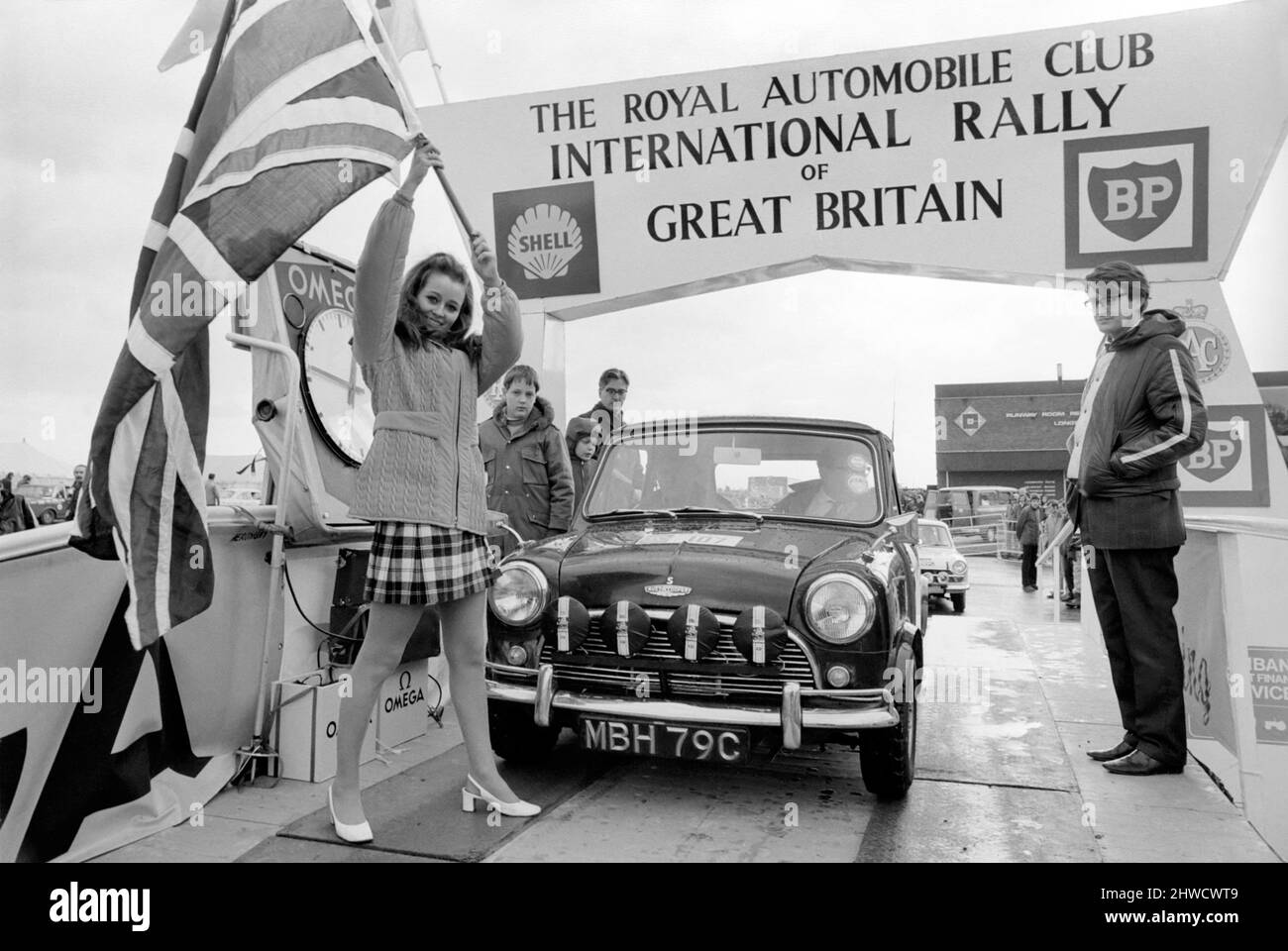 R.A.C. Rally: Miss U.K. Sheena Drummond, Waves the flag for the start of the R.A.C. Rally. November 1969 Z11051-002 Stock Photo
