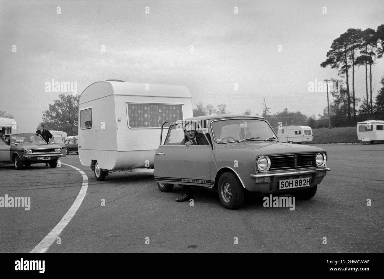 A caravan being towed by a mini clubman car.  November 1969  Z10726-005 Stock Photo