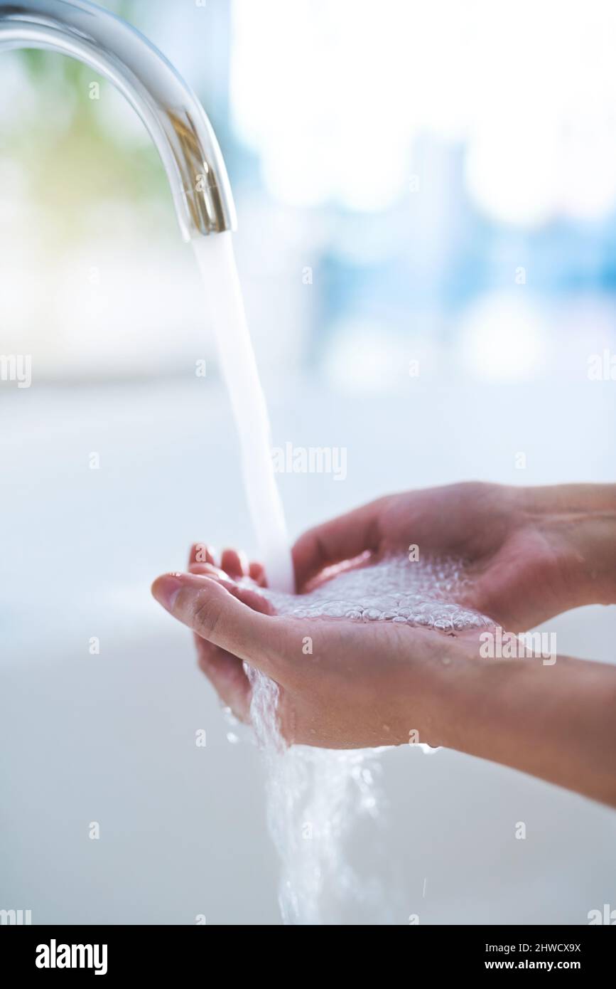 Wash away those germs. Shot of hands being washed at a tap. Stock Photo