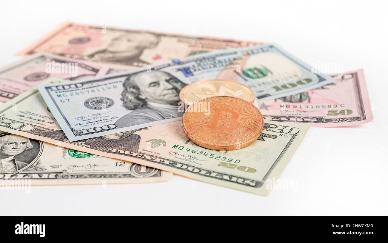 Bitcoin coins at dollar bills pile. Cryptocurrency and cash money concept.  High quality photo Stock Photo - Alamy
