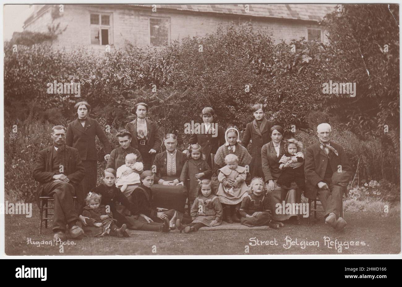 Belgian refugees in Street, Somerset, during the First World War. The group includes men, women and children (including babies) photographed in the garden of a large house. Members of the De Baecke family were amongst the Belgian refugees who took refuge in Street Stock Photo
