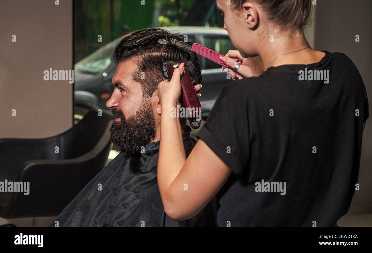 master Barber does the hairstyle and styling with electric shaver to