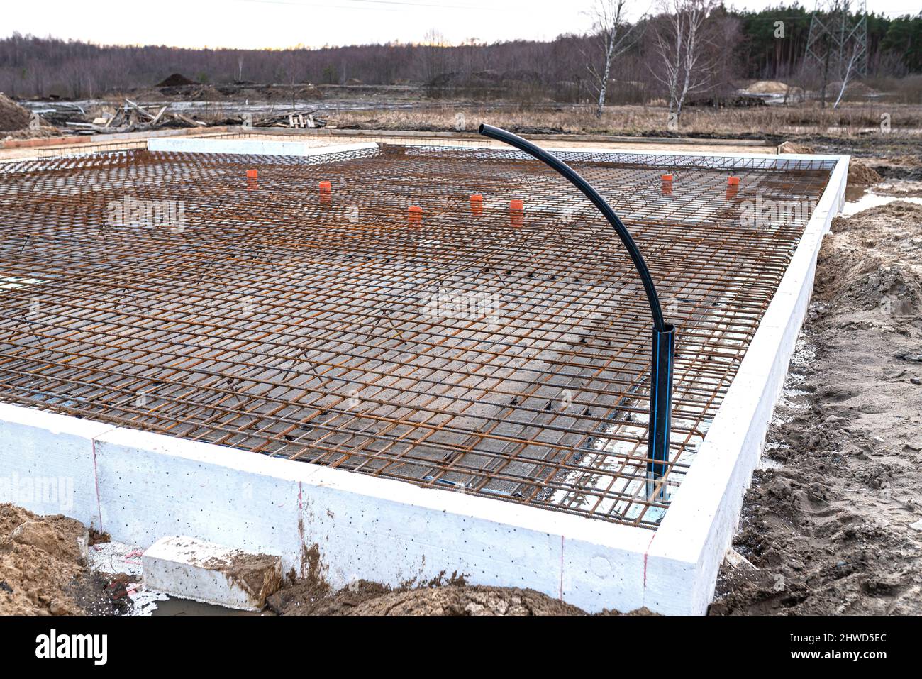 The foundation slab is made of reinforcement rods, bound with tie wire