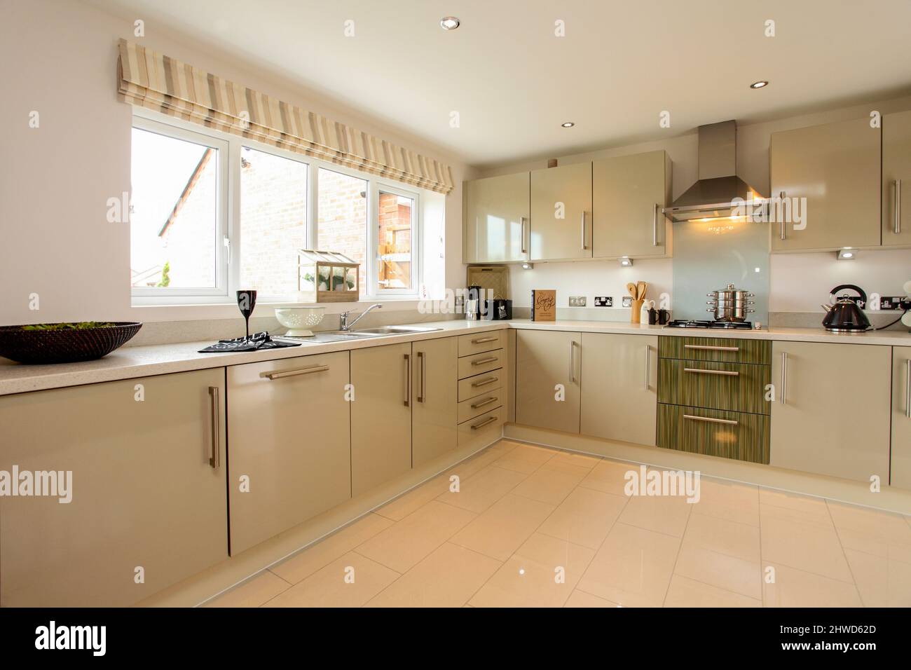 Kitchen in modern showhome, fitted kitchen units, floor and wall cupboards Stock Photo